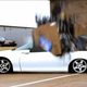Illustration for article titled Watch 1,500 Lbs. Of Cell Phones Dumped On A Camaro